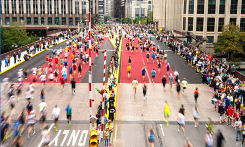 Participants crossing a bridge on course