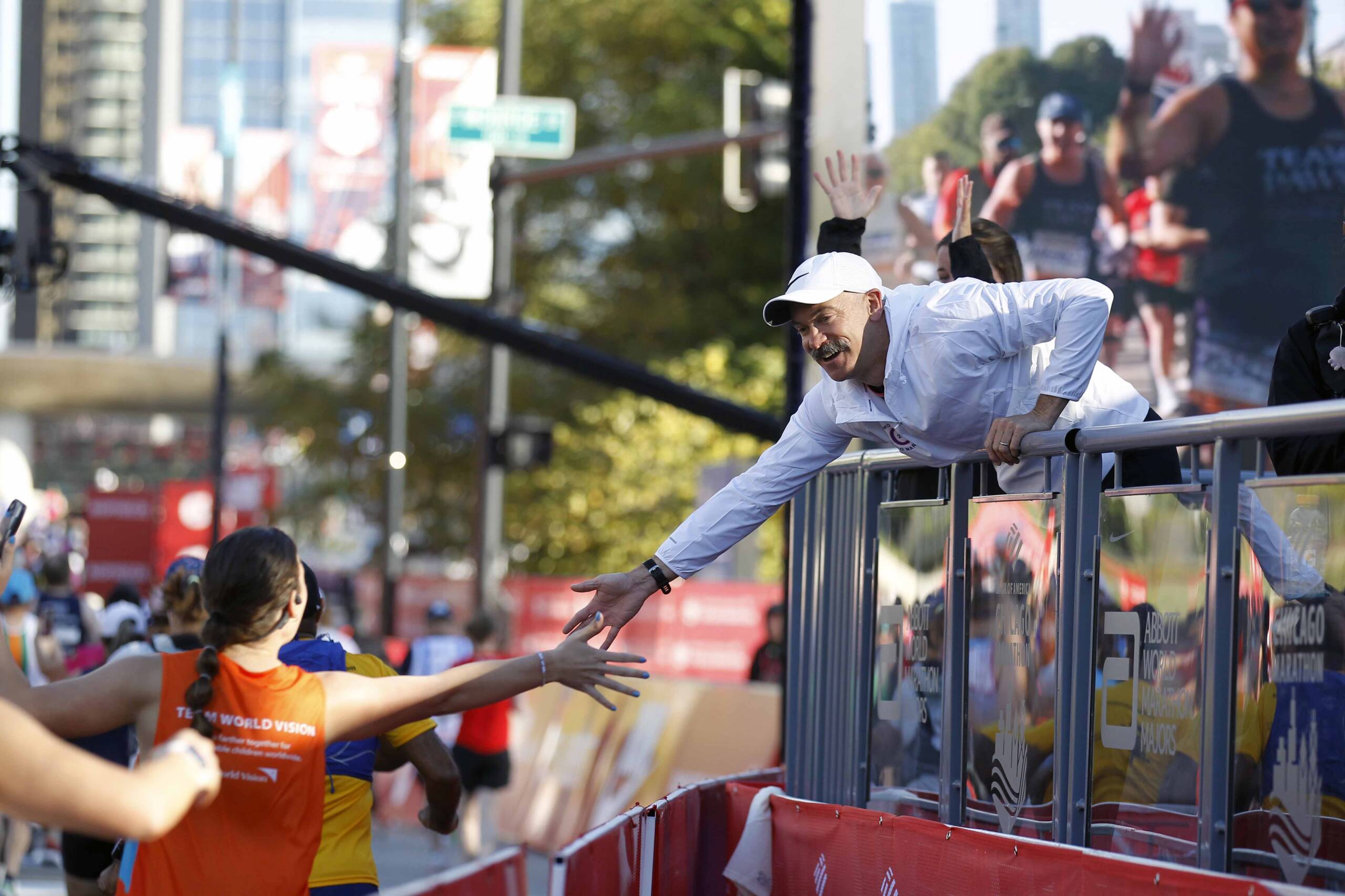 Nike's Coach Bennett greeting runners at the start line